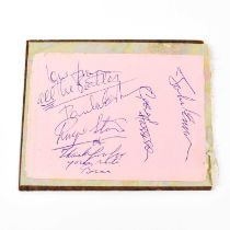 THE BEATLES; a torn page from an autograph book bearing signatures Paul McCartney, Ringo Starr,
