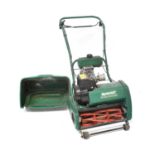 A Qualcast Classic Petrol 43S Lawn Trimmer. Condition Report: - Stored in a garage for an extended