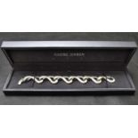 GEORG JENSEN; a pattern 452 Infinity bracelet, marked '925 Silver', length 18cm, in presentation