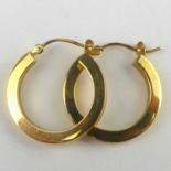 A pair of 14ct gold small hoop earrings, diameter of each 2cm, combined approx. 1.5g.