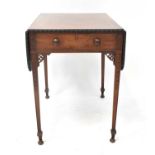A 19th century mahogany Pembroke table with a single frieze drawer, pierced aprons and carved square