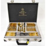 SOLINGEN; a sixty-eight piece gold plated cutlery set over two levels, in an aluminium-style carry