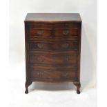 A Georgian-style mahogany bow-fronted bachelor's chest of four graduated drawers, with brushing