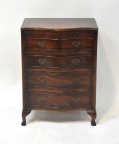 A Georgian-style mahogany bow-fronted bachelor's chest of four graduated drawers, with brushing