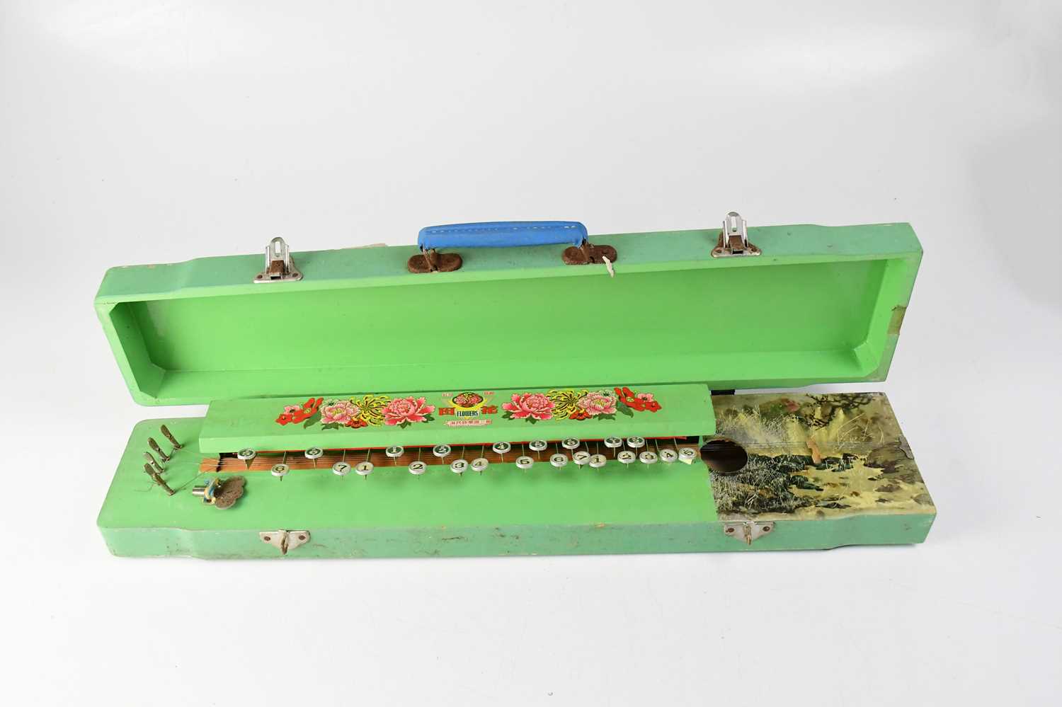 A Chinese flowers music harp stringed instrument, in a green painted case with transfer