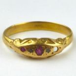An 18ct gold ring with ruby and diamond top, size X, approx. 3.5g. Condition Report: - The top