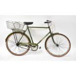 A Triumph 26 gentlemen's bicycle in green livery, with leather seat.