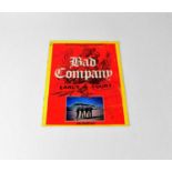 BAD COMPANY; an Earl's Court programme signed to cover by Mick Ralphs, Paul Rodgers, Boz Burrel