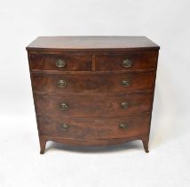 A George III bow-fronted mahogany chest of two short over three long drawers, on outswept bracket