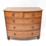 A Victorian mahogany bow-fronted chest of two short over three long drawers, raised on turned