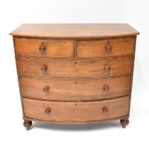 A Victorian mahogany bow-fronted chest of two short over three long drawers, raised on turned