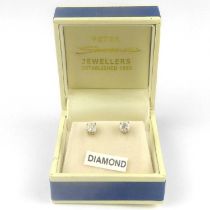 A pair of 14ct white gold and diamond stud earrings, each claw set brilliant cut diamond approx. 0.