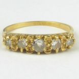 An 18ct gold five-stone diamond ring, the table with five graduated claw set diamonds, size S,