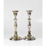 COOPER BROTHERS & SONS LTD; a pair of Elizabeth II hallmarked silver loaded candlesticks, London