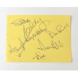 SLADE; a torn page from an autograph book bearing signatures to include, Noddy Holder, Don Powell,
