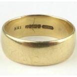 A 9ct gold wide band ring, size V, approx. 7.3g.
