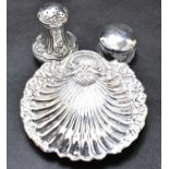Three pieces of hallmarked silver, comprising a shell dish, length 11cm, a small pepperette,