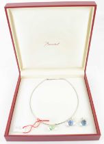 BACCARAT; a modern silver necklace with three interchangeable coloured glass pendants, in