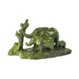 PAUL K. GALLE; a carved malachite figure group of three elephants by a tree, on naturalistic base,