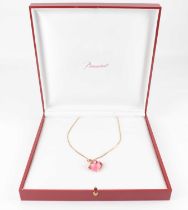 BACCARAT; a gold-plated silver necklace with pink claw set cabochon pendant, in presentation case.