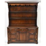 GOSTIN; a Georgian-style oak dresser with enclosed plate rack above a base of three drawers, above