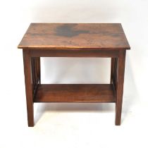 A mahogany side table with rectangular plank top, above square legs with turned supports and an