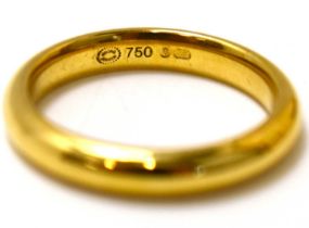 GEORG JENSEN; an 18ct yellow gold band ring, size N, approx. 5.6g, marked 'Georg Jensen 750' to