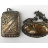 Two pieces of hallmarked silver, comprising a small vesta case with floral scrolled pattern,