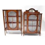 An Edwardian mahogany satinwood line inlaid break-front display cabinet raised on square section
