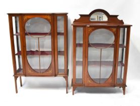 An Edwardian mahogany satinwood line inlaid break-front display cabinet raised on square section