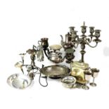 A large quantity of silver plated ware including a five-branch candelabrum, an epergne, tureens,