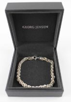 GEORG JENSEN; a boxed sterling silver (925) multi-twist link bracelet with lobster claw clasp,