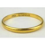 A 22ct gold thin band ring, size R, approx. 1.95g.