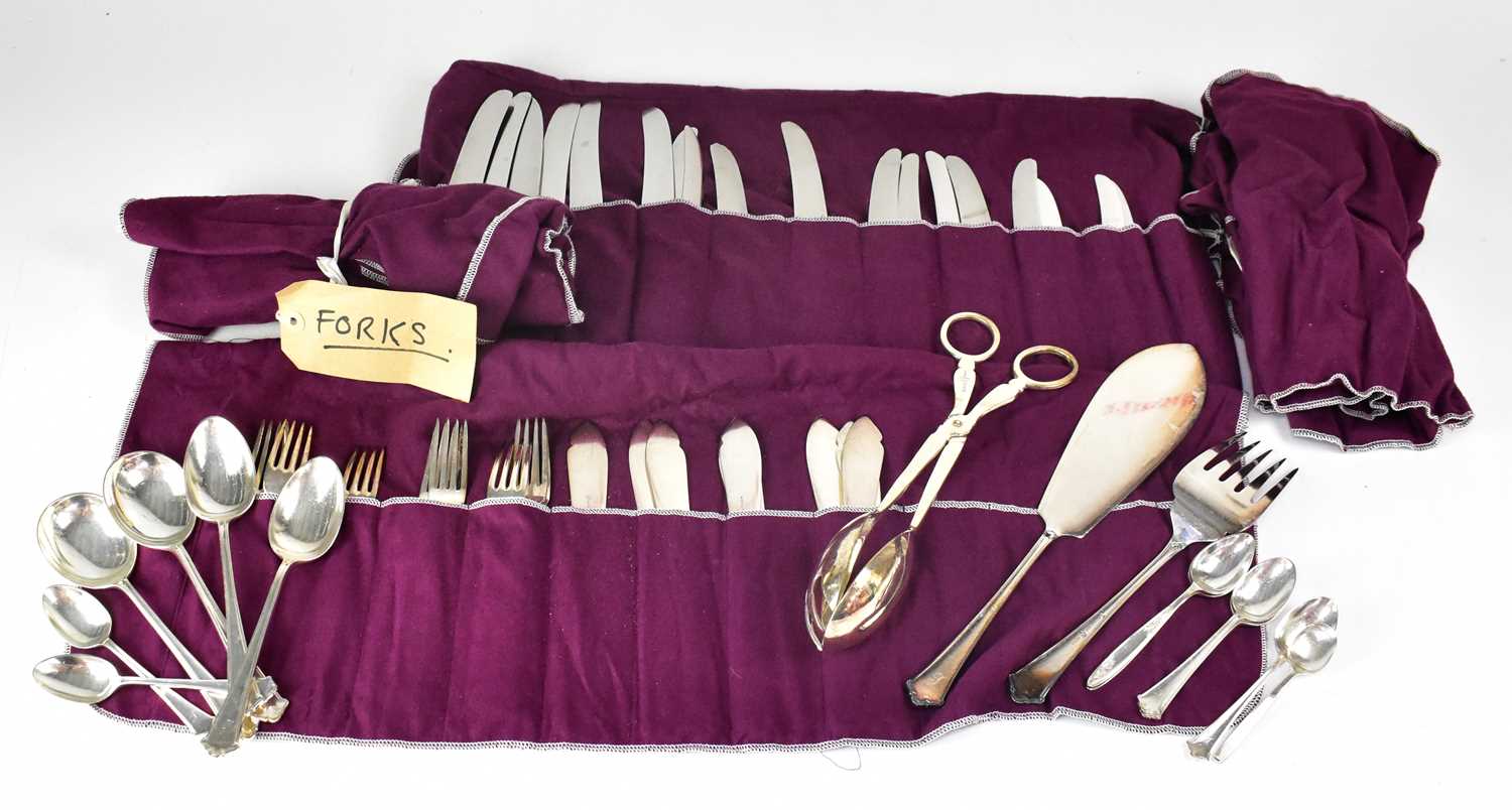 A quantity of silver plated cutlery, comprising knives, forks, spoons, fish servers and tongs.