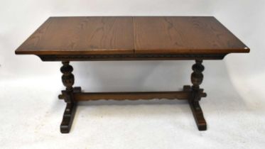 OLD CHARM; a reproduction oak extending refectory table, with two additional leaves, 75 x 228 x 81cm