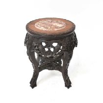 A Chinese carved hardwood jardinière stand, with marble inset panel to the top, height 37cm,