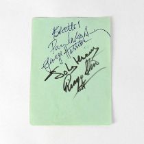 THE BEATLES; a torn page from an autograph album bearing the signatures of Paul McCartney, John