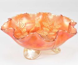 A Fenton carnival glass bowl decorated with 'Stag and Holly' pattern, with frilled edge, raised on