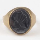 A 9ct gold intaglio ring, the rub-over inset oval engraved with head of a centurion, the 9ct gold