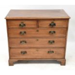 A George III mahogany chest of two short over three long graduated drawers, with pressed brass