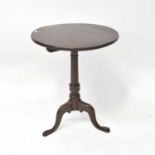 A 19th century style circular tilt-top occasional table, on a turned column and tripod cabriole
