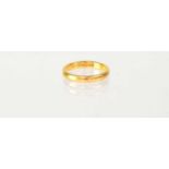 A 22ct yellow gold wedding band, stamped '22', size I, approx. 3.1g.