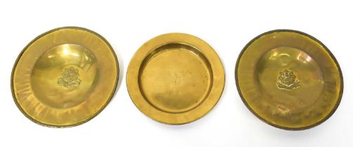 Three brass collection plates, two centred with the embossed logo for the Cheshire regiment,