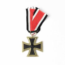 A WWII period Third Reich Second Class Iron Cross with ribbon.