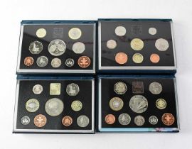 Eight cased sets of United Kingdom proof coins, limited editions issued by Royal Mint with