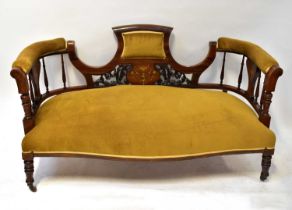 An Edwardian inlaid rosewood and mahogany two-seater settee upholstered in gold velour, with pierced