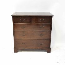 An early 20th century mahogany chest of two short over three long drawers, raised on bracket feet,