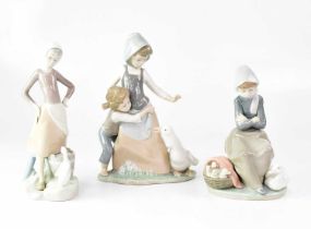 LLADRÓ; three figure groups of young ladies with geese, height of tallest 25.5cm (3). Condition