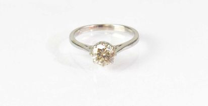 A 9ct white gold solitaire diamond ring, with champagne-coloured stone in a claw mount, with