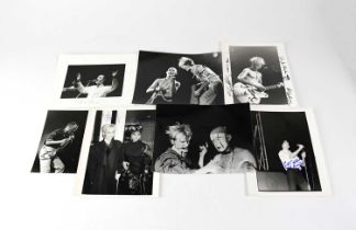 Thirteen signed black and white promotional photographs to include David Byrne, Jimmy Sommerville,